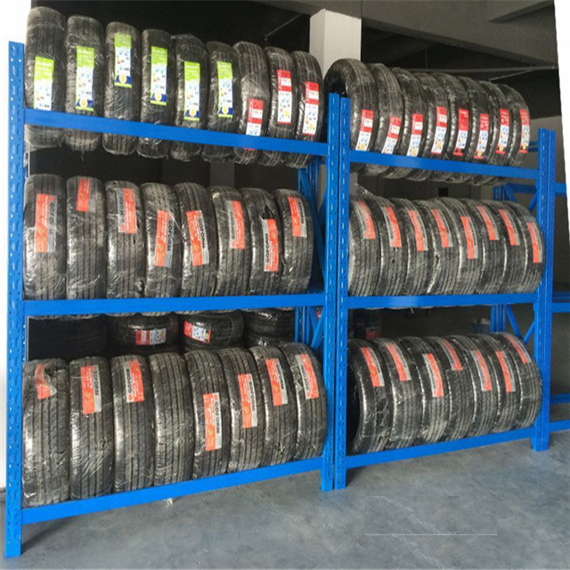 Tyre storage shelving rack with stacked car tyres in warehouse storage system New Zealand