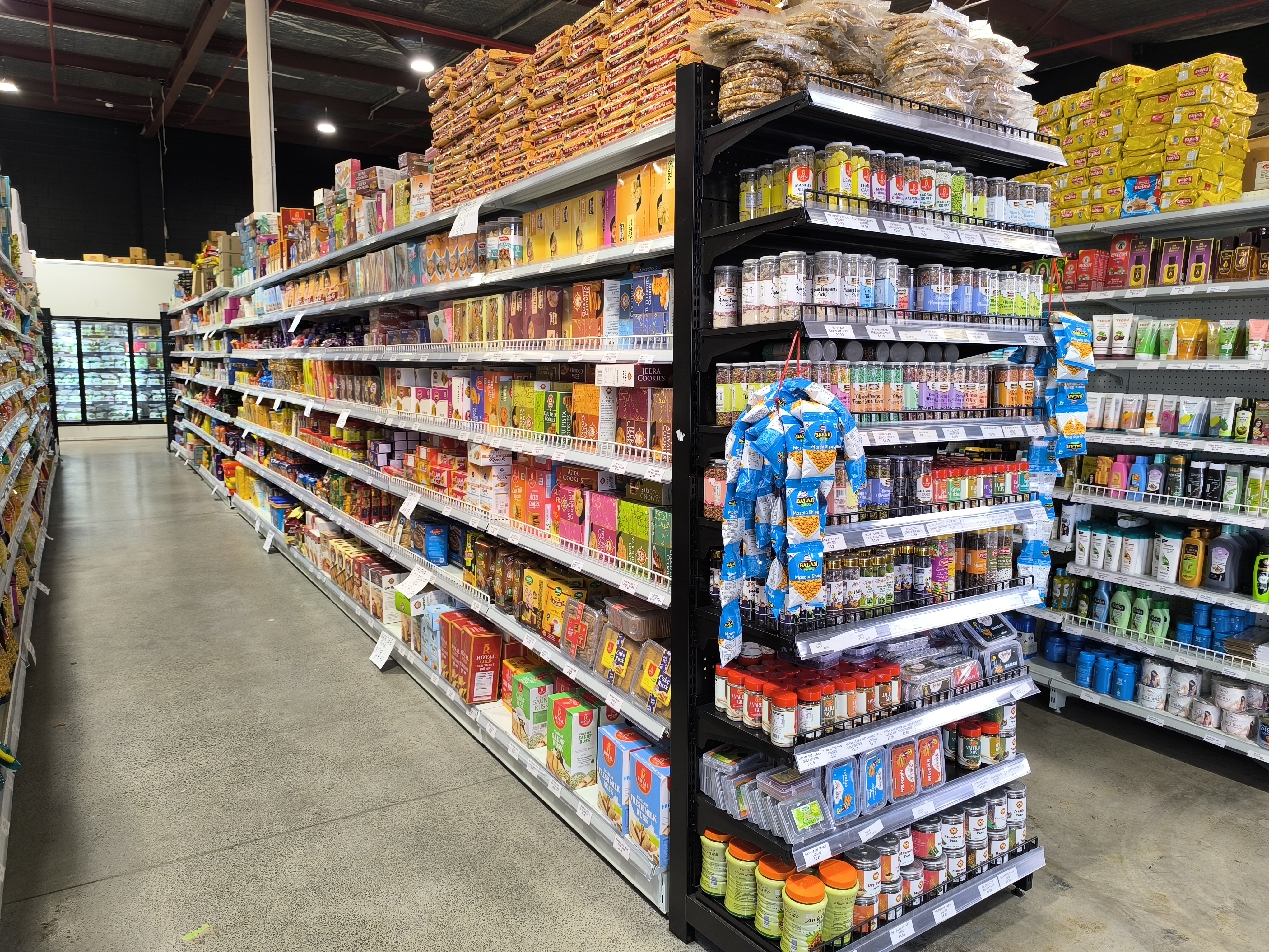 Asian supermarket aisle with packaged foods, sauces, and grocery products at Kiwi Choice New Zealand