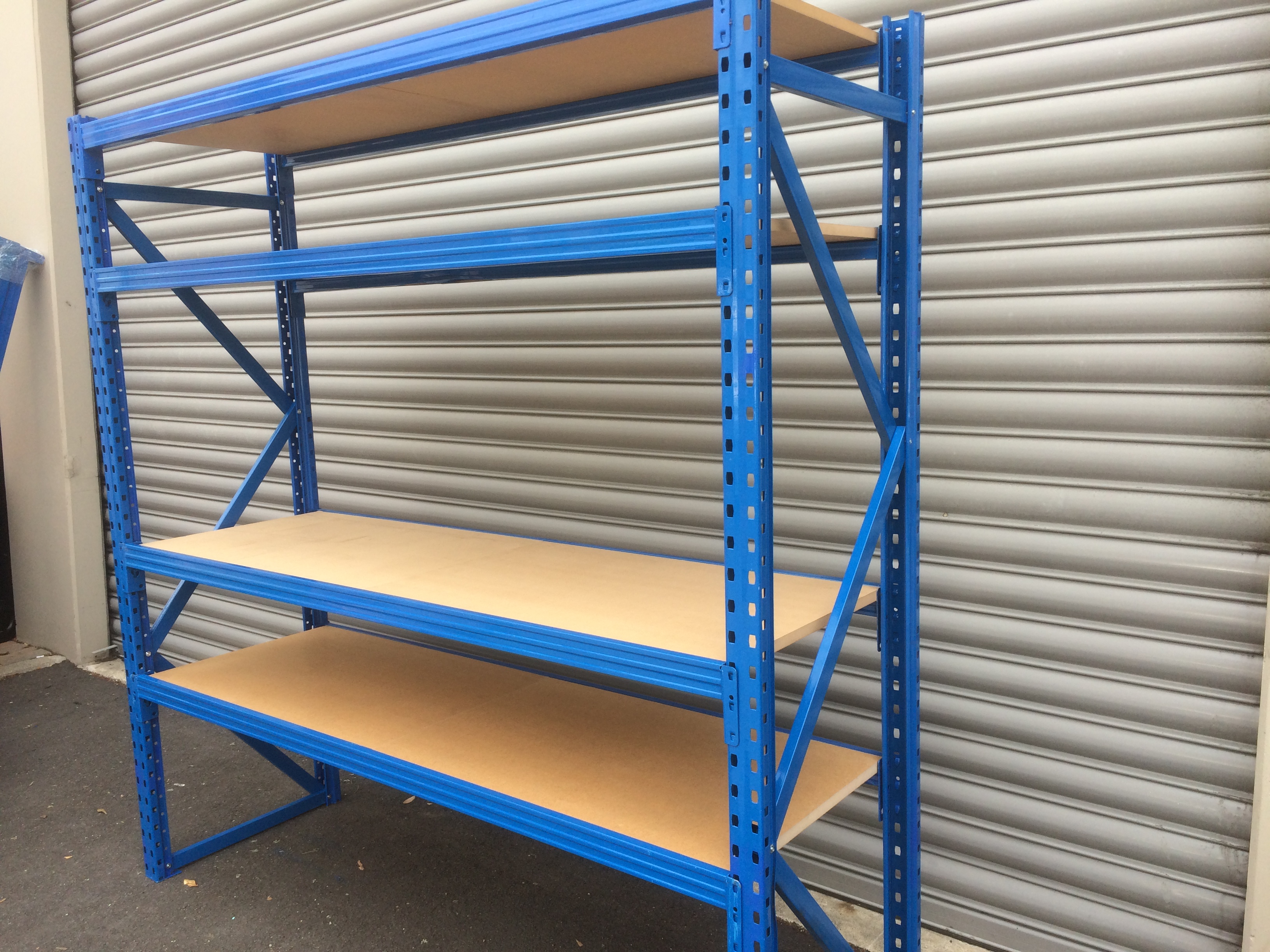 Heavy duty steel shelving unit with wooden shelves for warehouse and garage storage New Zealand