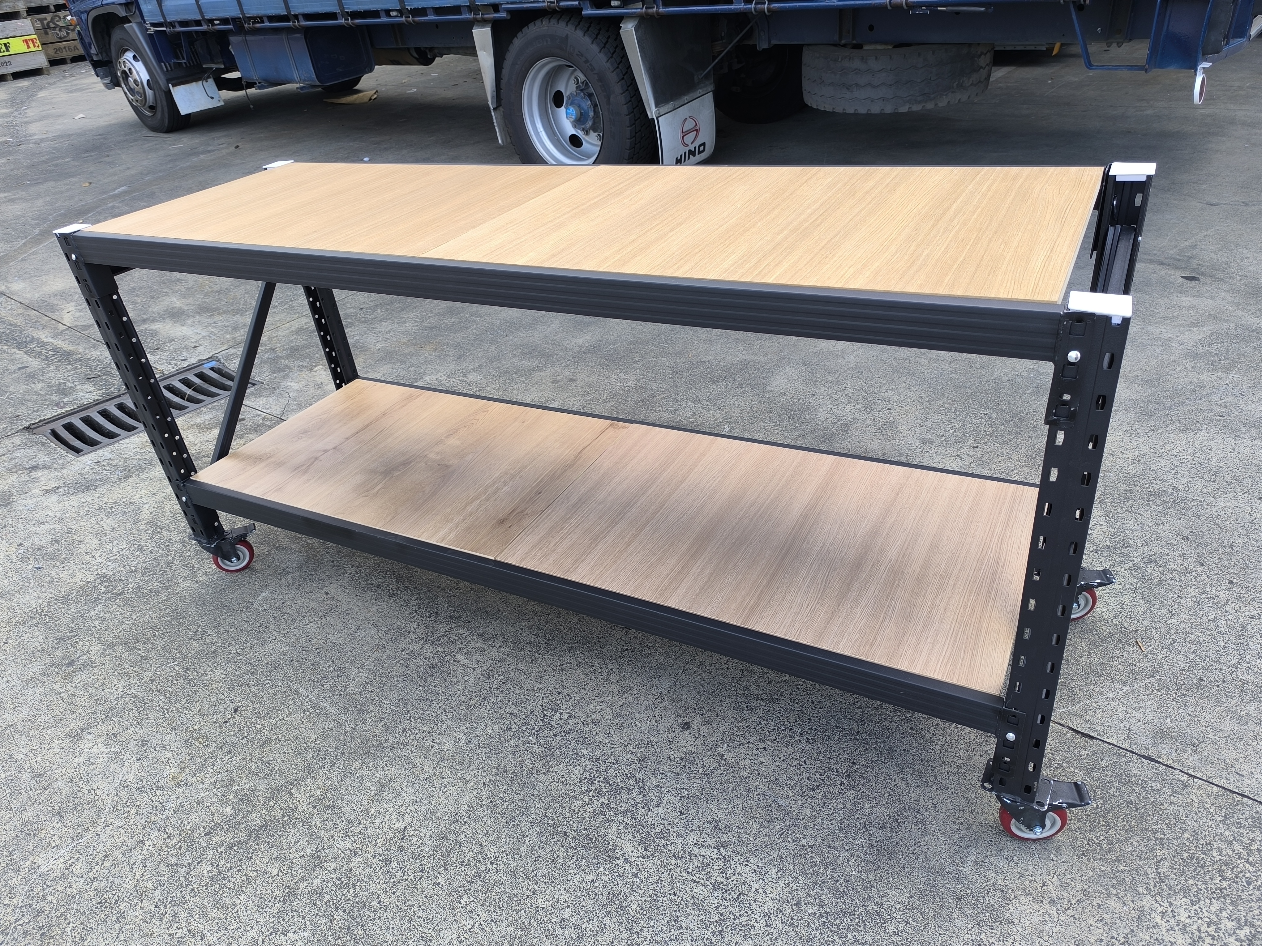 Heavy duty mobile workbench with wooden top and steel frame on wheels for workshop use New Zealand