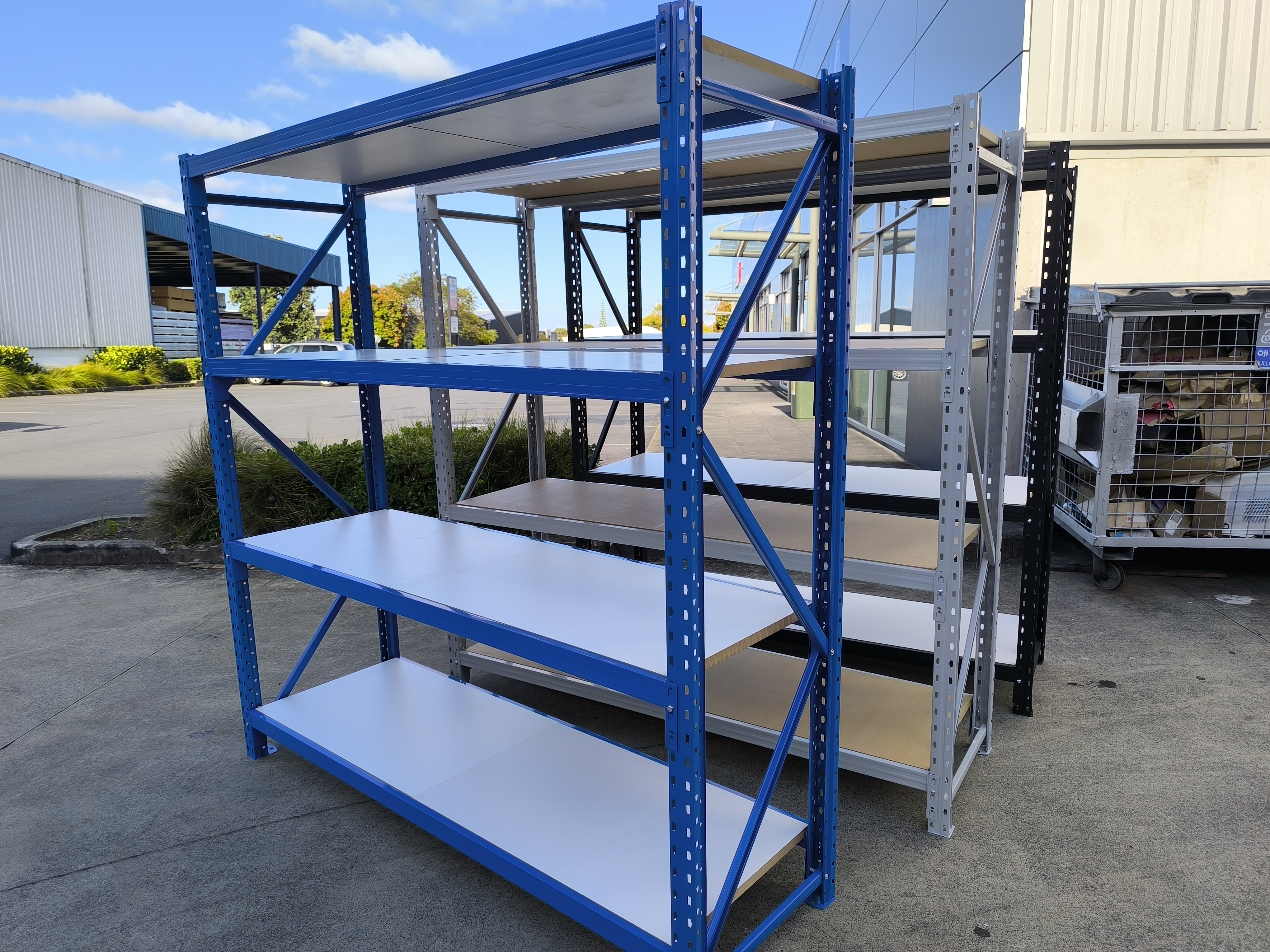 Long span shelving units with steel frame and white shelves for warehouse storage solutions New Zealand